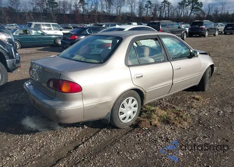 2001 Toyota Corolla Le z USA, uszkodzony, nr VIN 2T1BR12E61C501771